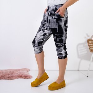 Черные женские брюки 3/4 PLUS SIZE с рисунком - Одежда