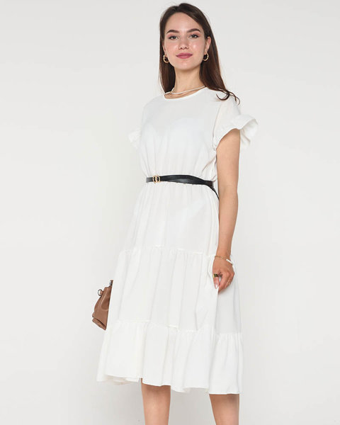 Біла жіноча сукня з воланами
